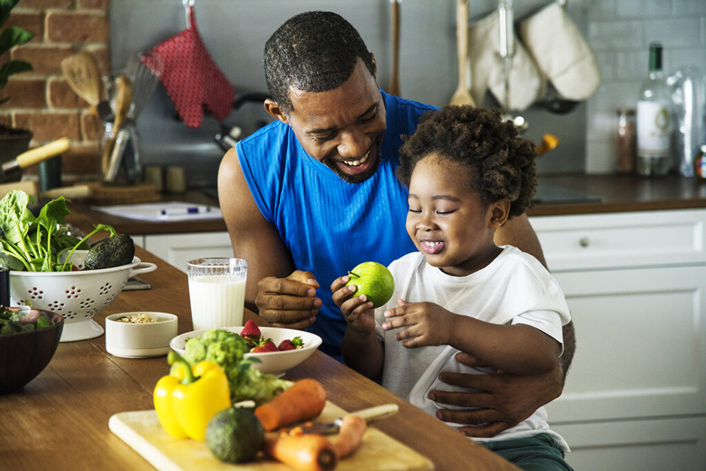 Dad and son cooking together